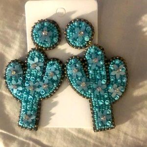 Brand new turquoise cactus earrings. Very lightweight.